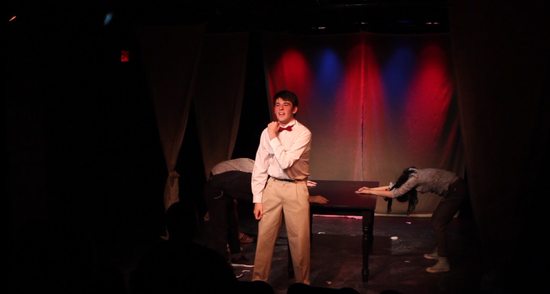 The Fire Eater introduces his main attraction:  the House of Puppets and Waffles!