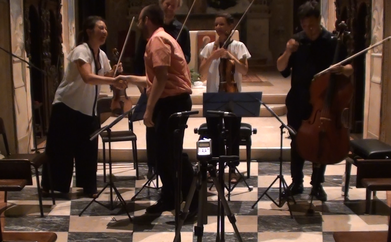 Connor greets Quartetto Indaco after the performance of his work.