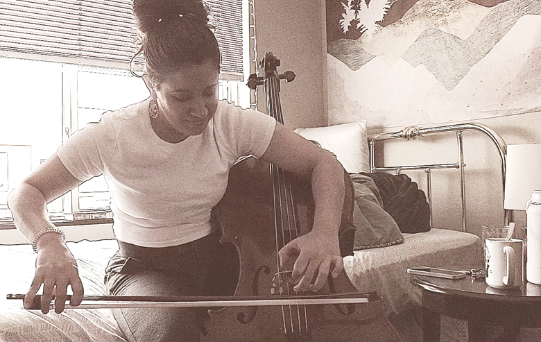 Carolina Rodriguez de Armas demonstrates bowing below the bridge on the cello.