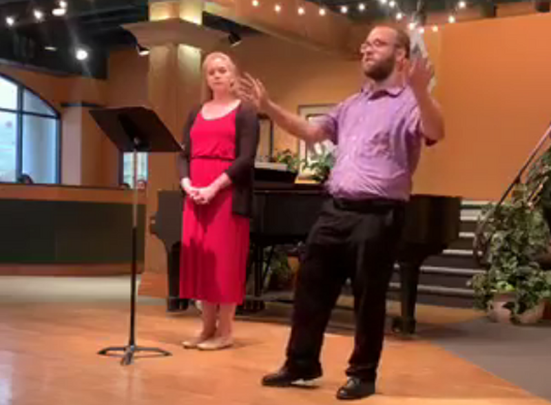 Connor speaks to the audience about his song cycle "Essences."