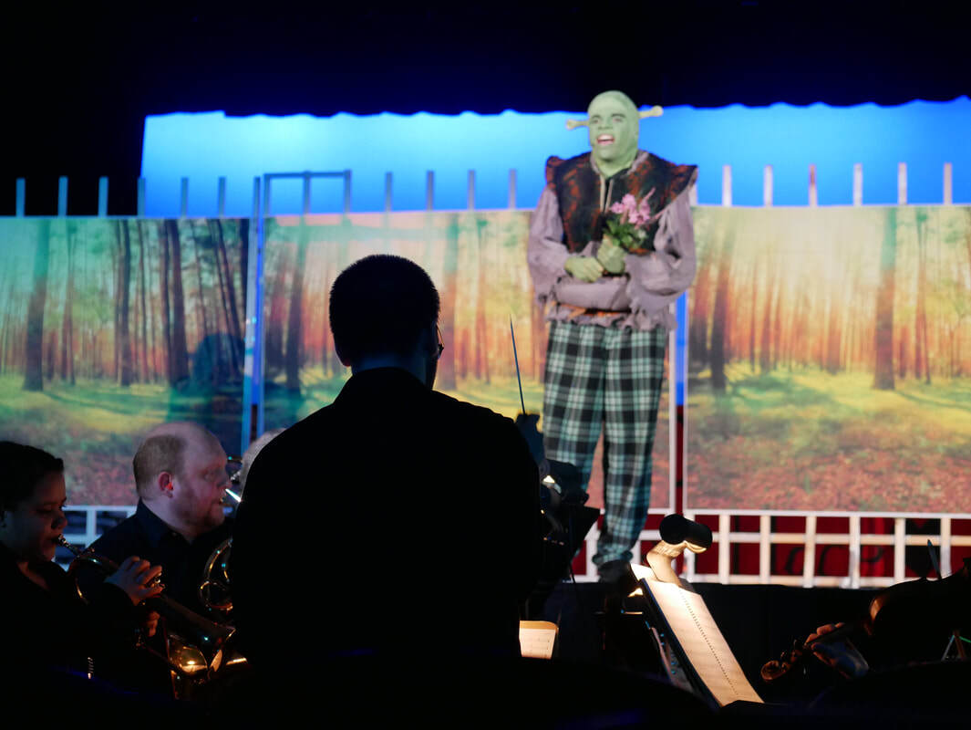 Connor conducts the band and cast of Springfield Central High School's 2019 production of 