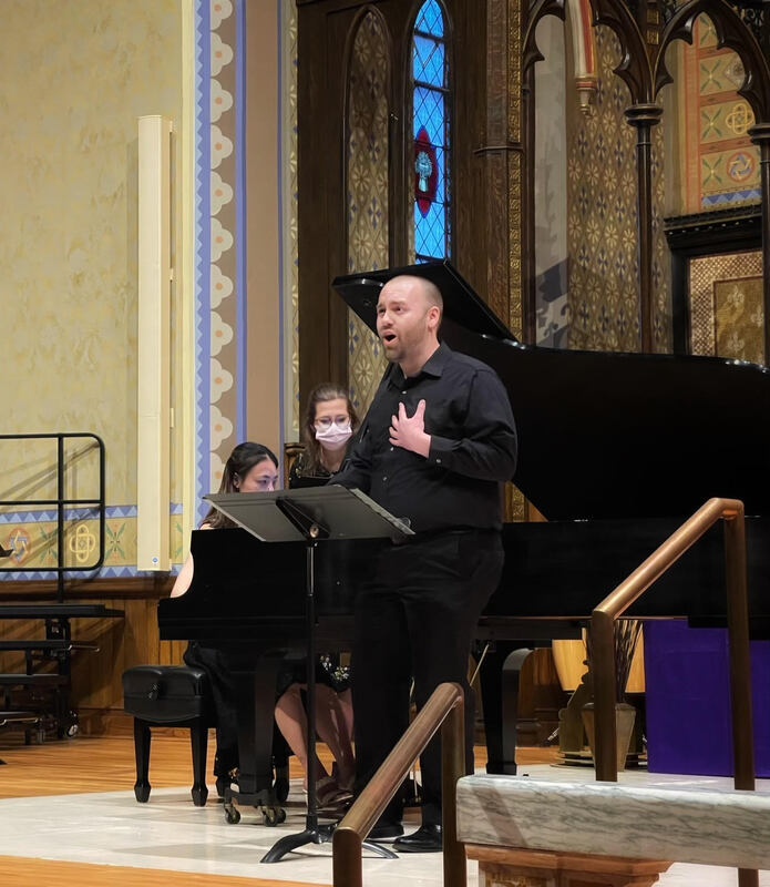 Connor Gibbs singing with Vivian Chan playing piano.