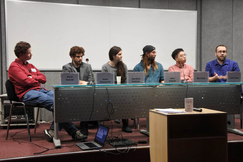 Group of composers listen to Connor speaking at the 2019 International Composition Workshop at European University Cyprus.