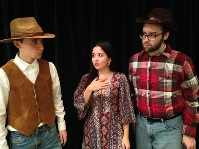 Charlie Romo, Sylvia Maison, and Connor Gibbs stand in costume.