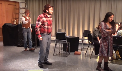 Connor Gibbs sings heroically during an opera scene.