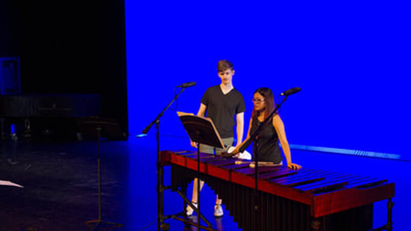 Steve Sharp and Crystal Chu rehearse Connor's trumpet and marimba duet.