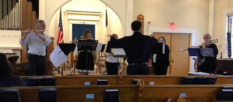 Connor conducts the premiere of Acceptance, his work for flute quintet.