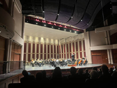 Connor follows his score for his orchestral work which is being read by the Toledo Symphony Orchestra.