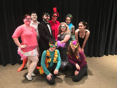 Cast of opera production painted up as birds and animals.