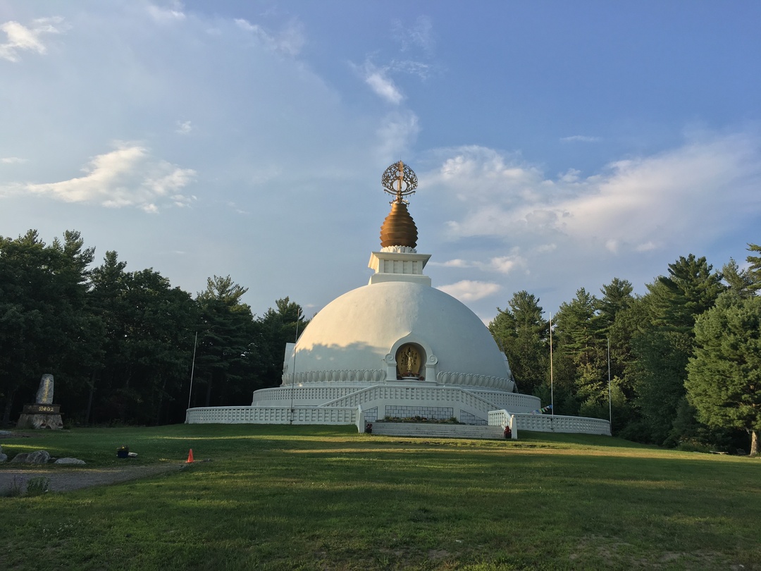A distant view of the massive, white Peace Pagoda in Leverett, Massachusetts.