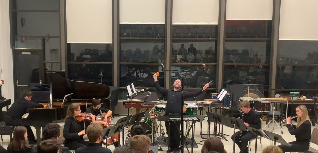 Connor sings his work with Pierrot ensemble, cheering toward the sky.