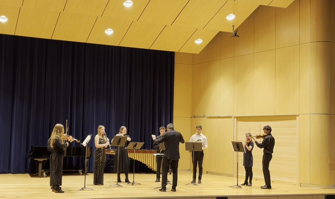 Thomas Fortner conducts an octet of student musicians for Connor's chamber ensemble work.