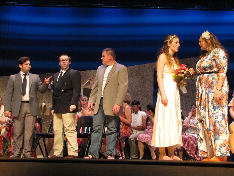 Connor Gibbs standing with Justin Begin and Fred Warren in a scene from Mamma Mia.