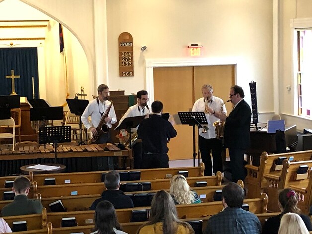 Connor conducts Edward Orgill, Bruce Elliot, Jason Koerber, and Michael Cortina, who are performing his saxophone quartet.